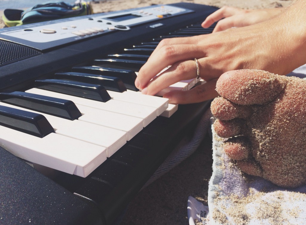 Piano at the beach and toes in the sand