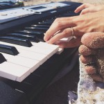 Piano at the beach and toes in the sand