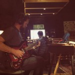 Producer Raymond Richards playing guitar on new album